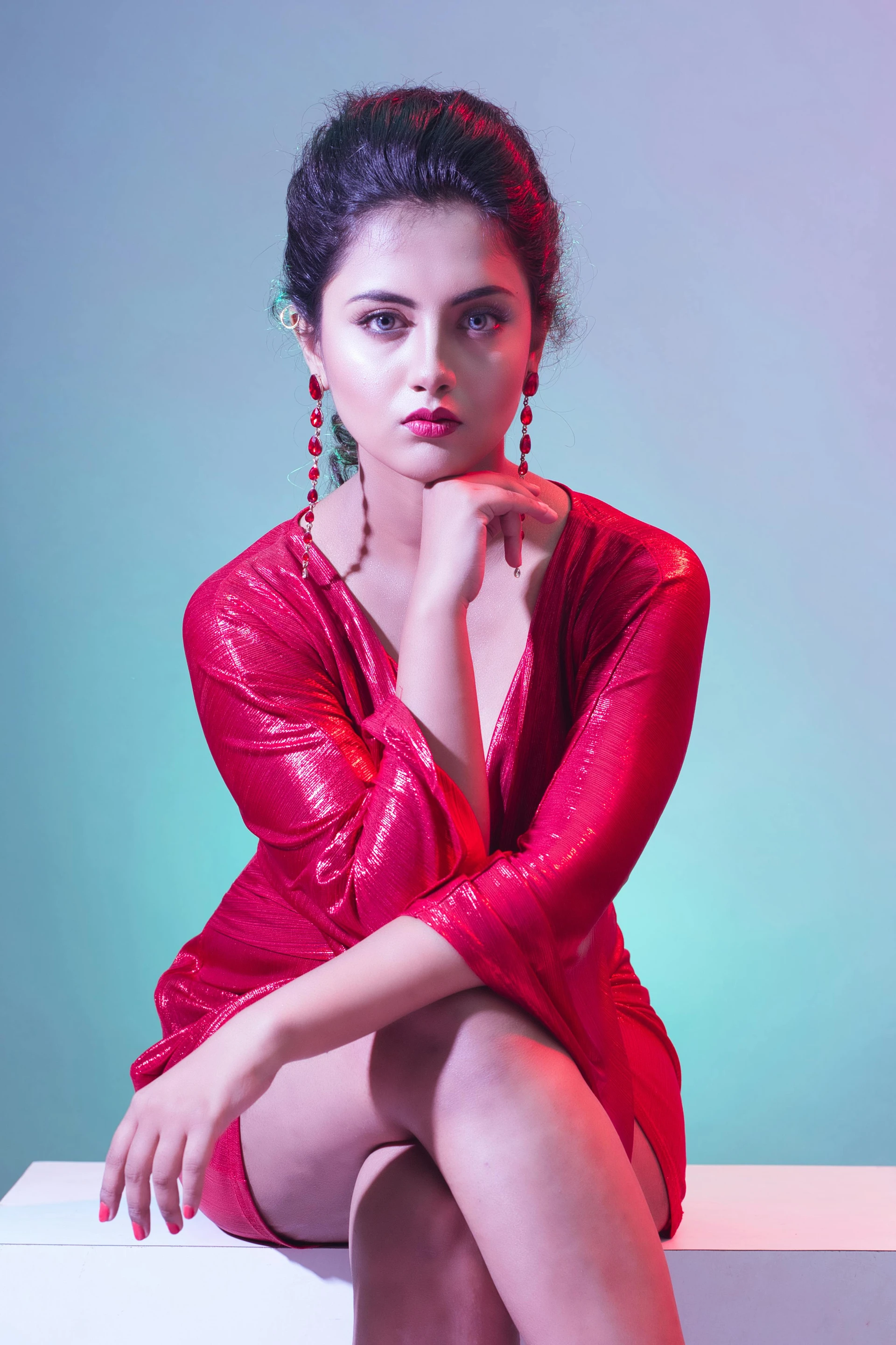 Sitting Poses in Red Shiny Mini Dress for Party